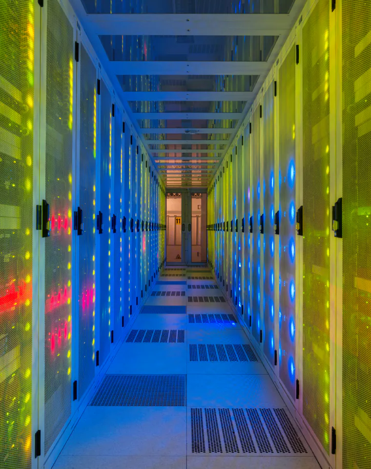 Cybersecurity: colorful corridor between data center server racks