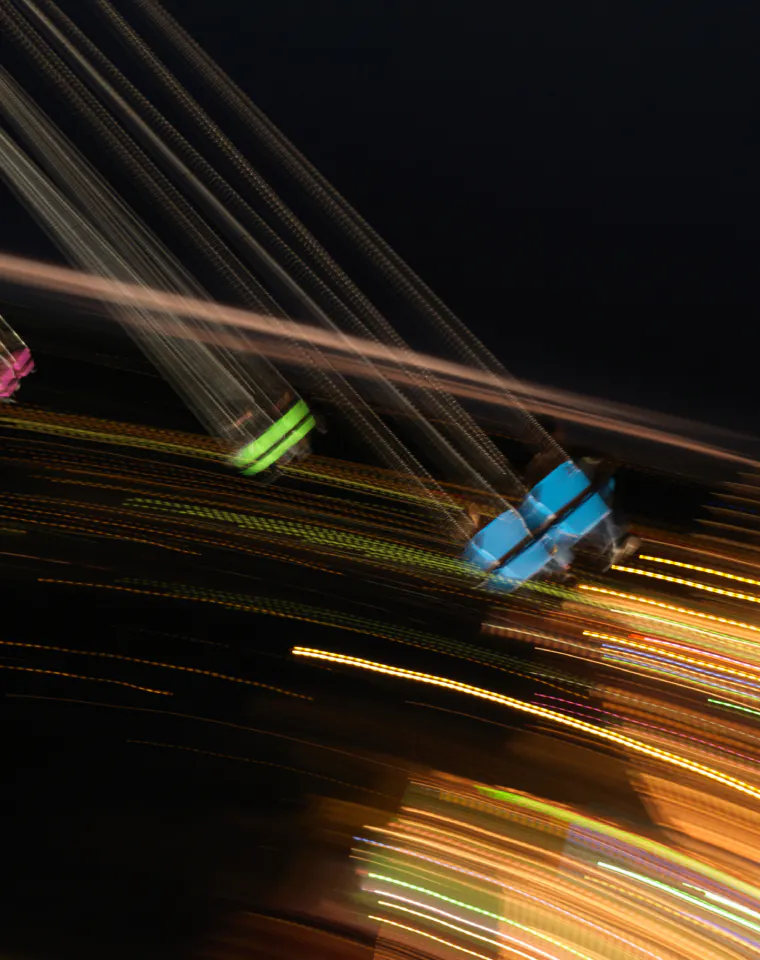 Data Processing & Analytics: streaks of light in motion on a dark background