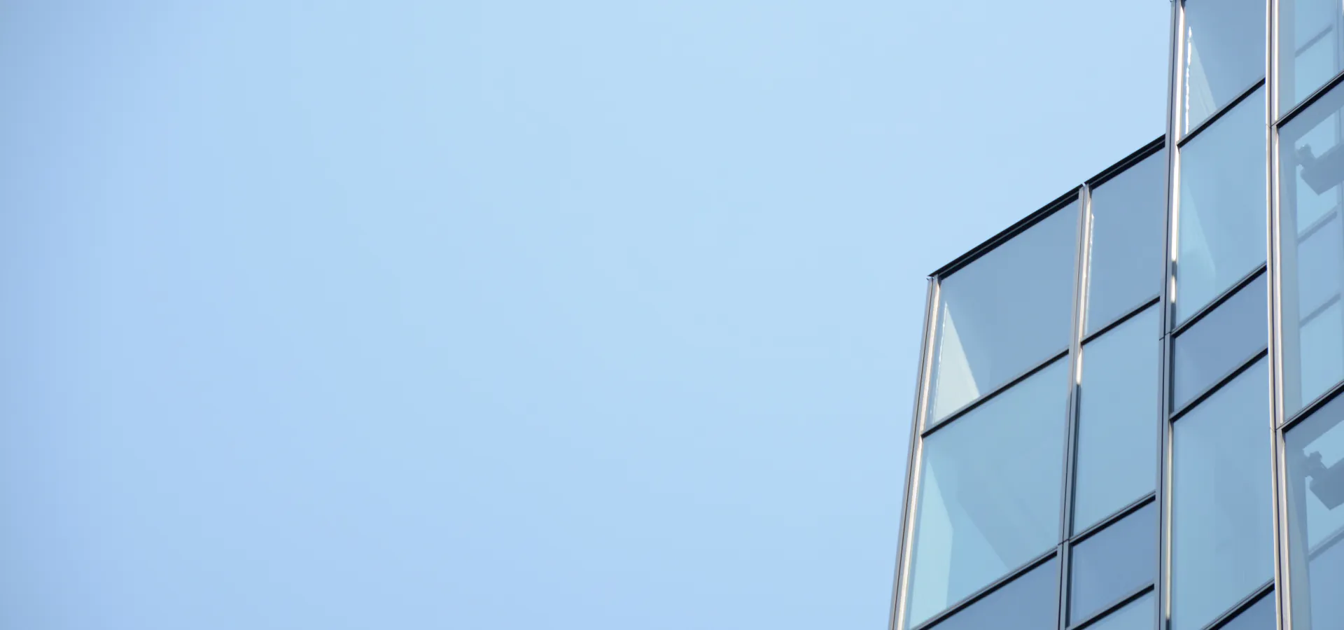 Top SAP Business by Design Consulting company Top SAP Business by Design Consulting company: modern glass office building against a blue sky
