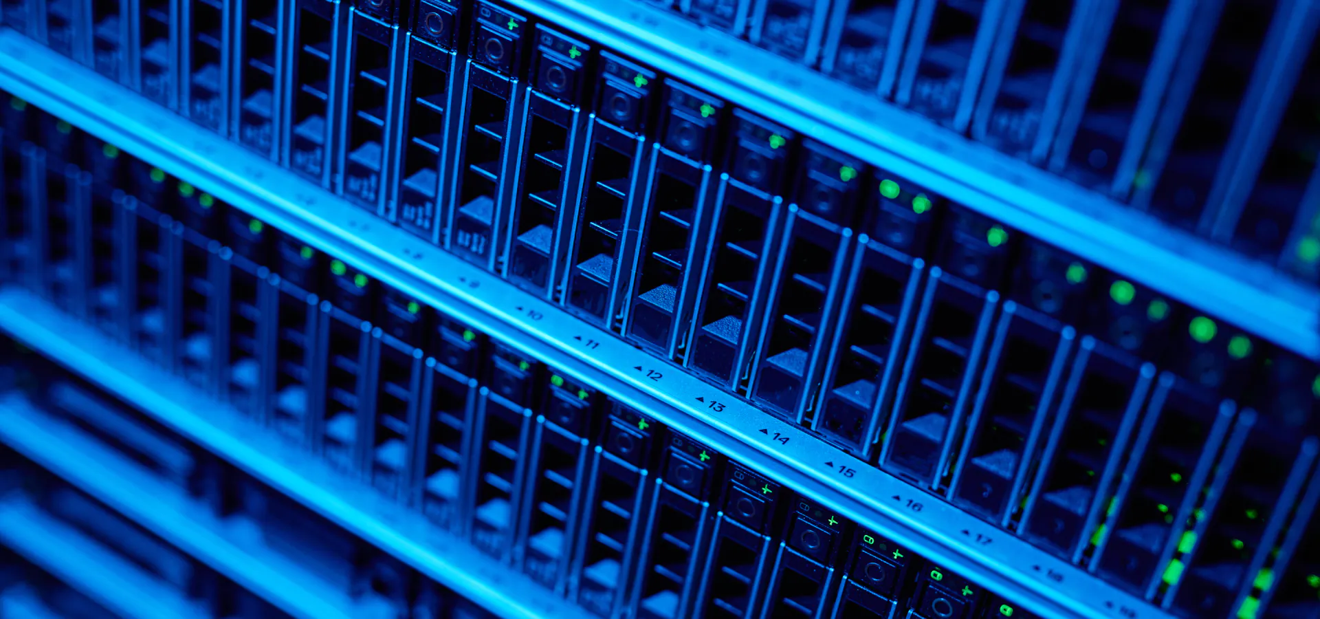 SaaS Cloud Application Consulting in Houston SaaS Cloud Application Consulting in Houston: close-up of blue-lit data center server racks