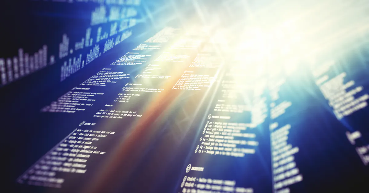 Cyber Security Services in Austin: lines of code on a screen with a bright light flare