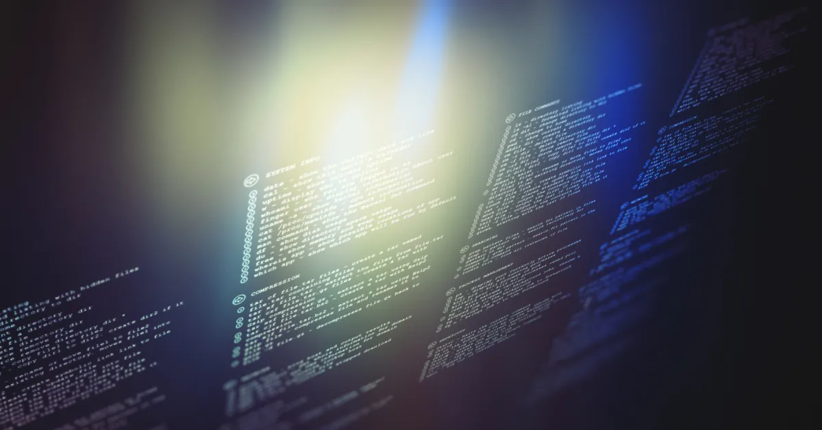7 Signs You Outgrew Off-the-Shelf Software: lines of code on a dark screen with soft light